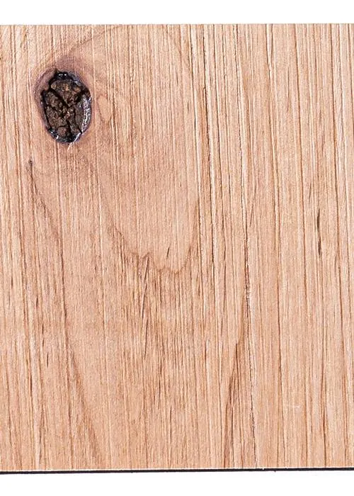 Macro close-up of the T3D Driftwood texture pattern cross-scored into alder, showing a real knot in the grain. Photo from t-three-d.myshopify.com.
